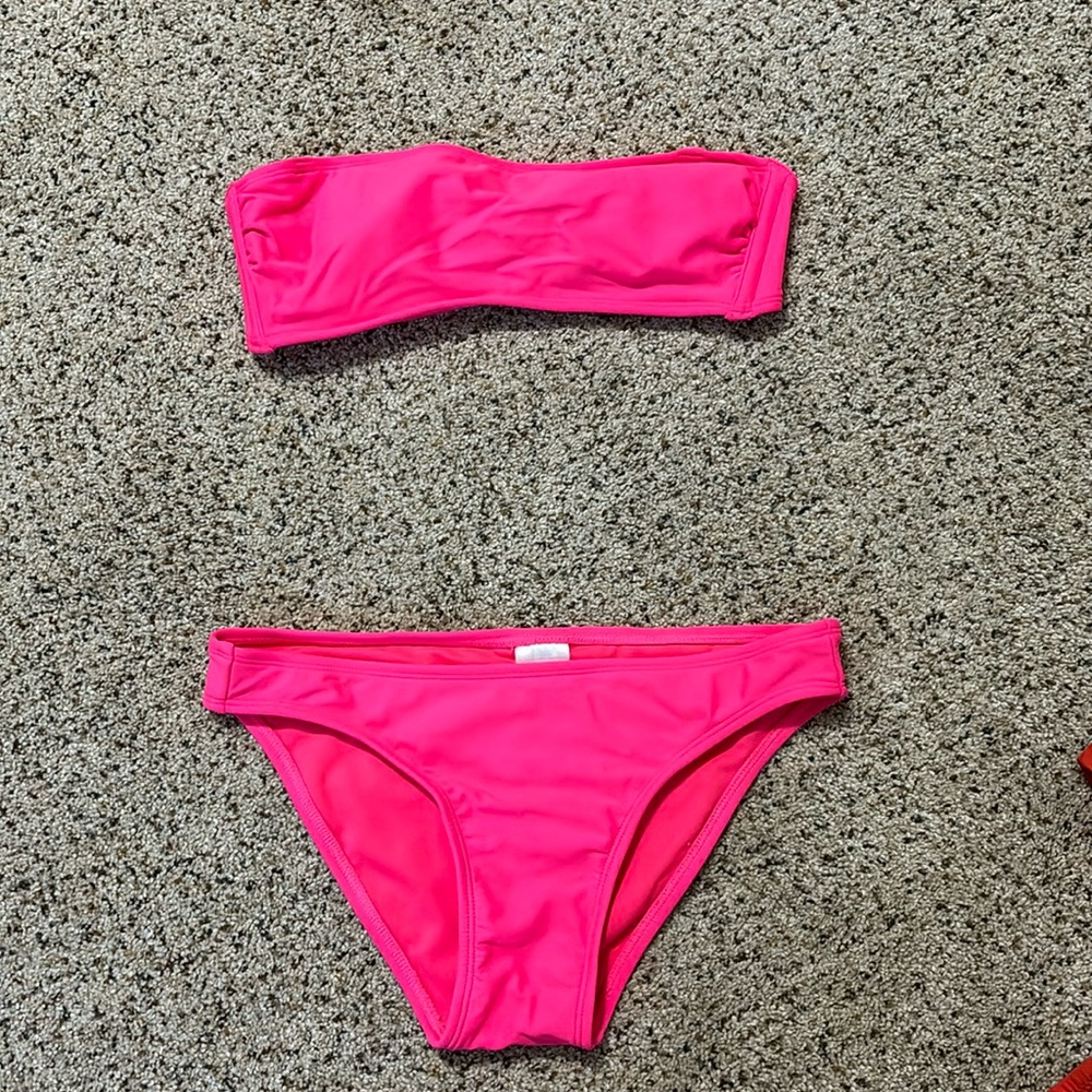 Pink strapless bikini. never worn. size medium in top and bottoms